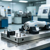 CNC-machined stainless steel medical test jig with locating pins, non-marring clamps and secured medical component for device validation