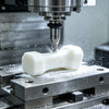 5-axis CNC machining medical grade PEEK bone blank in Shenzhen factory workshop